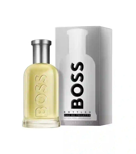 Perfume Boss Bottled Eau de Toilette para hombre de 100 ml con fragancia amaderada especiada y notas de manzana, canela y sándalo.
